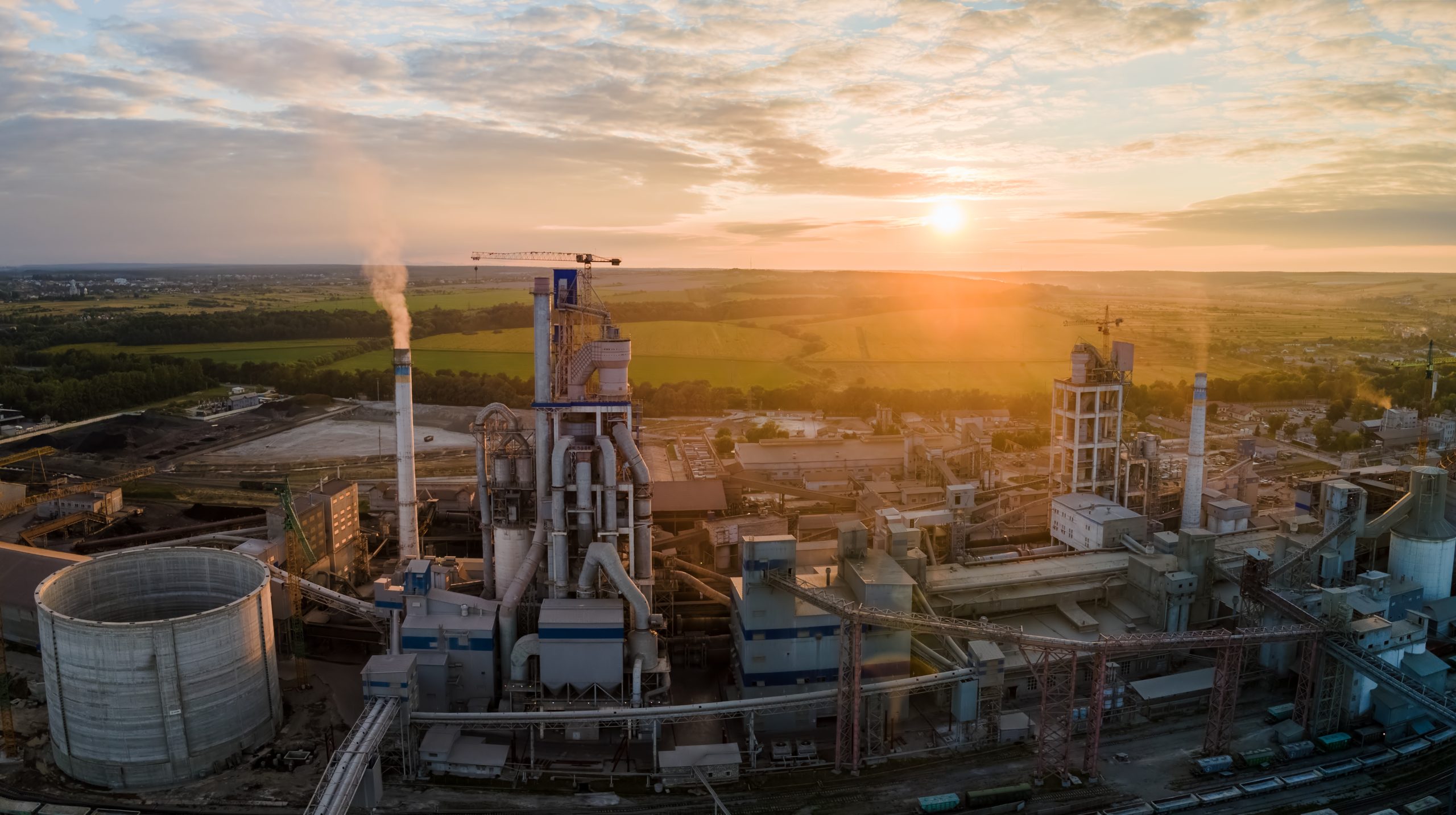 Aerial view of cement factory tower with high concrete plant str